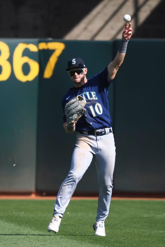 Sep 20, 2023; Oakland, California, USA; Seattle Mariners left field Jarred Kelenic (10) throws the ball during the ninth inning against the Oakland Athletics at Oakland-Alameda County Coliseum.